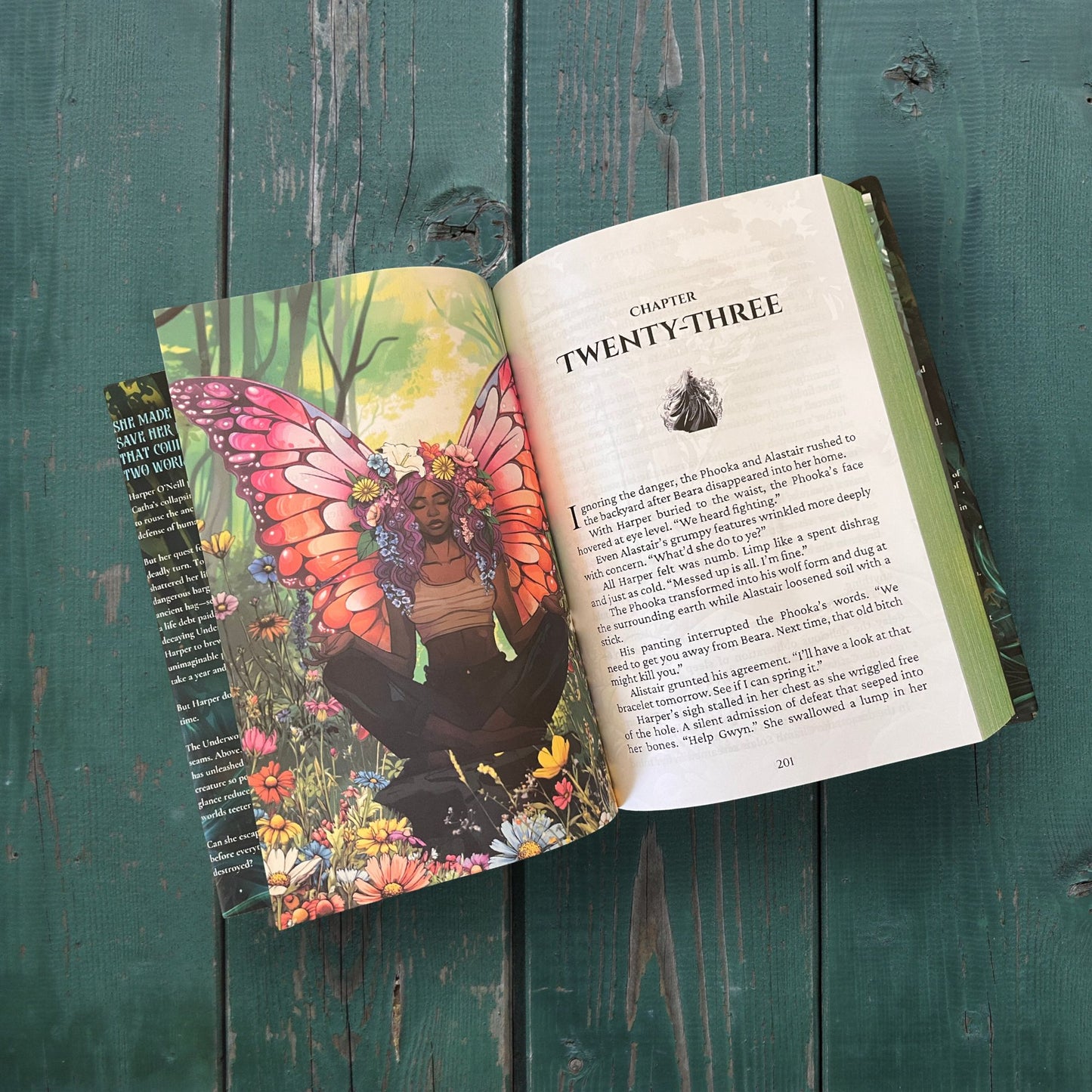 Image of Escape from the Underworld, book 3 in the dark fae Celtic myth urban fantasy series by Molly J Stanton.  One side shows an African Fae with flowers for hair and the other a chapter header with unique icon