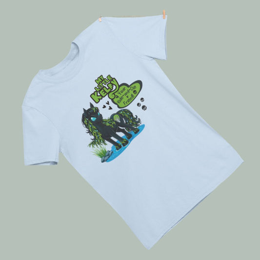 light blue tee shirt featuring a kelpie water horse creature from Scottish mythology.  The creature is in a my little pony style and is black with seaweed in its mane. text in the my little pony style reads My Little Kelpy: Your ride-and-die friend.
